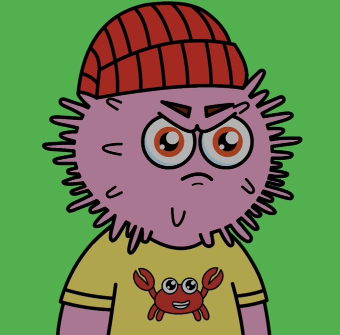 A cartoon character with purple spiky hair, a red beanie, an angry expression, and a yellow shirt featuring a smiling red crab.