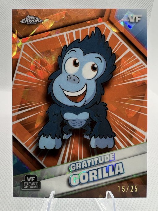 A Topps Chrome trading card features a smiling blue gorilla character named 'GRATITUDE GORILLA', numbered 15/25.
