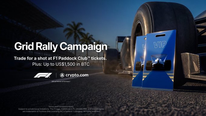 A promotional banner for the "Grid Rally Campaign" invites users to trade for a shot at F1 Paddock Club™ tickets plus up to US$1,500 in BTC, featuring official F1 and Crypto.com logos alongside VIP paddock passes in front of a race car tire.
