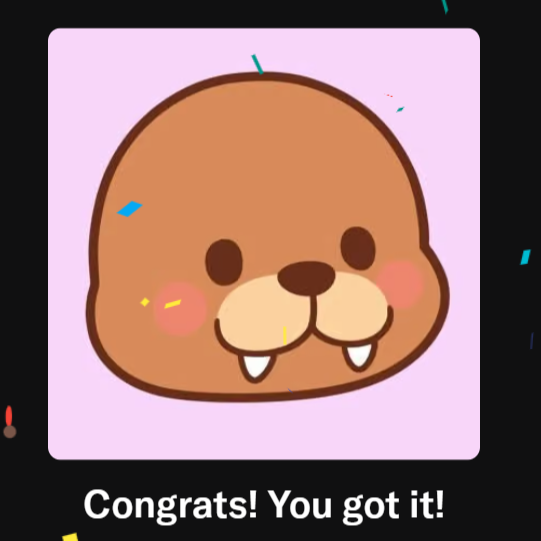 A mobile game notification with a cute seal character saying 'Congrats! You got it!' surrounded by confetti.