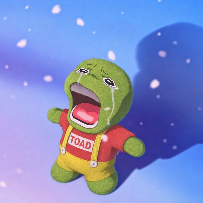 A 3D-rendered crying plush toy character resembling a frog in red and yellow clothing with a "TOAD" label, set against a snowy blue gradient background.
