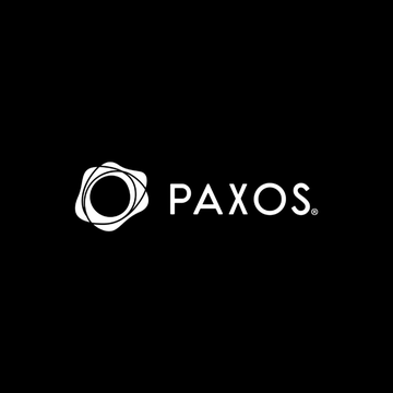 The image displays the Paxos logo, featuring a white circular emblem alongside the company name "PAXOS" on a black background, representing the regulated financial infrastructure platform mentioned in the announcement regarding its integration with Avalanche (AVAX) and USDC.