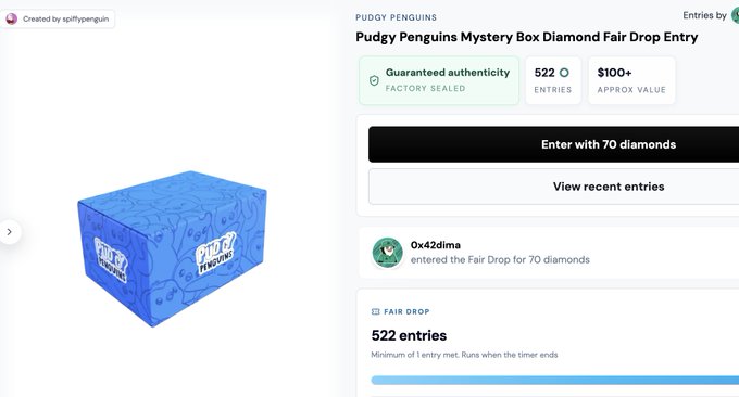 A blue "Pudgy Penguins" mystery box is displayed alongside a "Pudgy Penguins Mystery Box Diamond Fair Drop Entry" page showing 522 entries at 70 diamonds each, with an approximate value of $100+. The post notes surprise at the high entry count, explaining that fans of the Pudgy Penguins brand are eagerly spending dyli.io diamonds on Pudgy Penguins merchandise via the diamond fair drop.