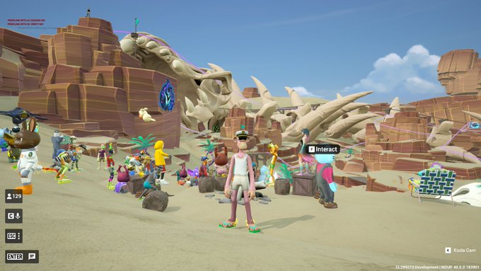 A screenshot from a video game showing a character in a desert-like environment with a large dragon skeleton and other players gathered nearby, with an 'Interact' prompt visible and version numbers 'CL294973 Development | MEDUP 40.0.0 T83901' in the corner.