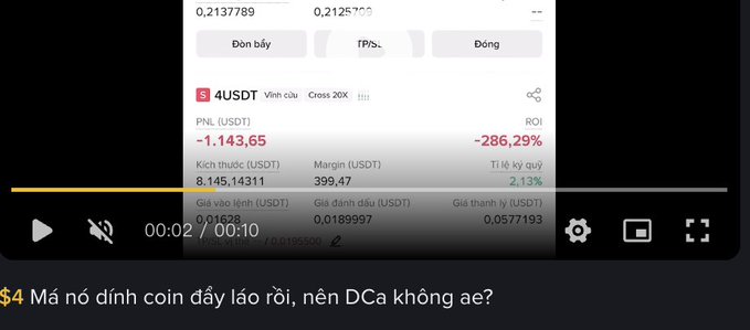 A Binance trading interface shows a losing short position on the 4USDT (VINH) perpetual contract with -286.29% ROI and a PNL of -1,143.65 USDT, displayed alongside video playback controls. The text overlay "Mà nó đỉnh coin đấy lão rồi, nên DCa không ae?" ("But that coin already peaked, so why DCA, bros?") questions whether to dollar-cost-average into the position, fitting the post's theme of VN traders debating whether to long or short the volatile coin.