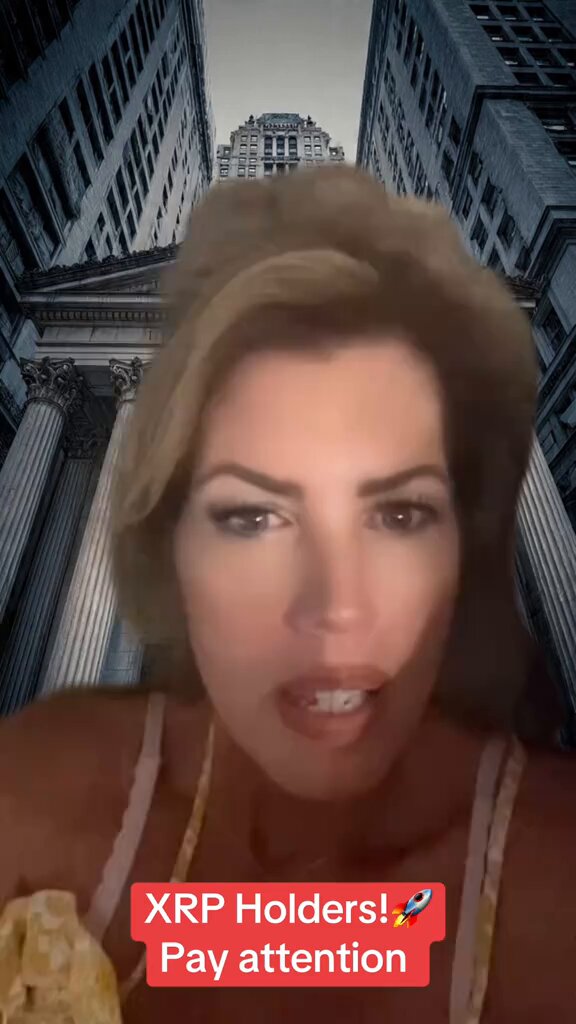 The image features a woman with blonde hair wearing a white tank top, standing against a backdrop of buildings. The caption reads "THE ONE THAT'S STILL HOLDING? THE ONES WHO STAY PATIENT Could BE WATCHING HISTORY unfold ... #XRP #Crypto #DiamondHands". This post is about Bitcoin and XRP, which are digital currencies that have gained popularity in recent years due to their decentralized nature.

The woman's expression suggests she might be discussing the current state of Bitcoin or XRP, possibly expressing her concerns or excitement about these digital assets. The image captures a moment where people engage with each other through social media platforms and share information related to various topics, including cryptocurrencies like Bitcoin and XRP.