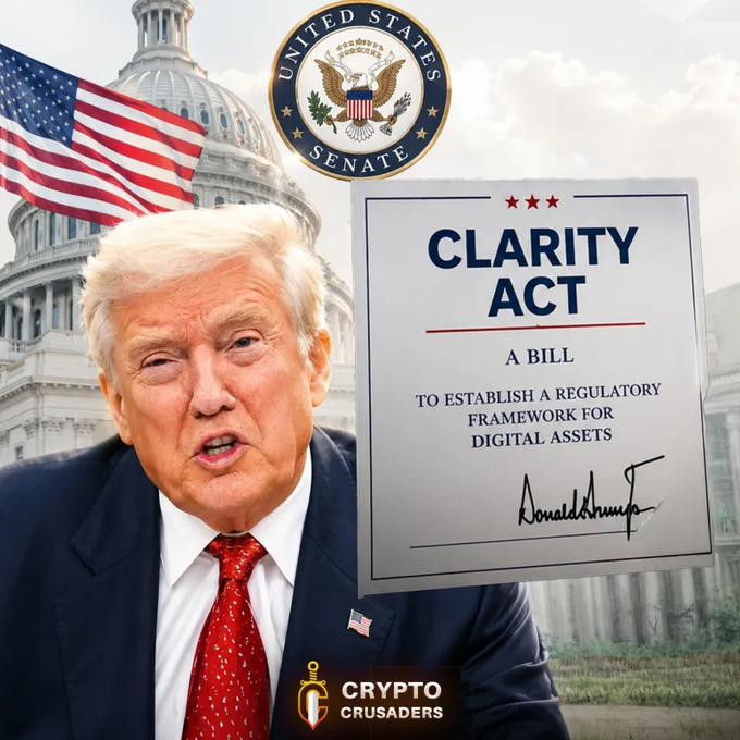 The image features a man wearing a suit, standing next to an American flag with the words "United States Senate" written above him. The caption below the image reads "THE US CANNOT LEAD GLOBAL DIGITAL ASSET RULES WITHOUT THE CLARITY ACT!! LETS GET THIS DONE $XRP AND CRYPTO FAM!". This suggests that the man is advocating for a clearer understanding of digital asset rules and regulations, which could potentially impact the cryptocurrency market.