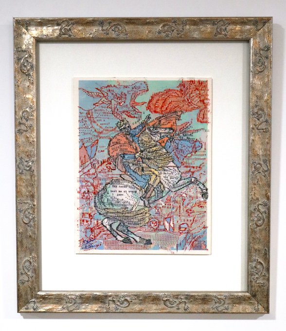 A framed abstract artwork featuring colorful line drawings with red, blue, and green hues depicting figures and animals, displayed in an ornate silver frame.