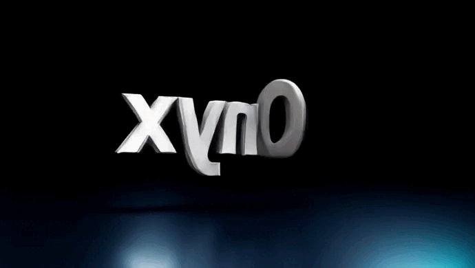 The image features a large white logo with the word "X" written in all capital letters against a black background. The text appears to be floating or hovering above the image due to its size and position, creating an interesting visual effect. The surrounding area is dark, which further emphasizes the prominence of the logo.