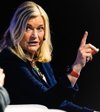 Senator Cynthia Lummis speaks passionately while gesturing with her finger raised, advocating for the passage of the CLARITY Act for crypto regulation.
