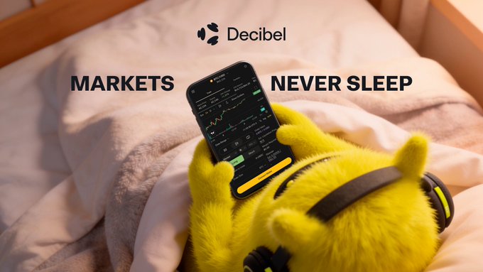 A fuzzy yellow character wearing headphones lies in bed holding a smartphone displaying a trading chart on the Decibel app, with the tagline "MARKETS NEVER SLEEP" and Decibel's logo above — visually reinforcing the post's message about 24/7 onchain trading infrastructure on Aptos that operates even while the rest of the world sleeps.