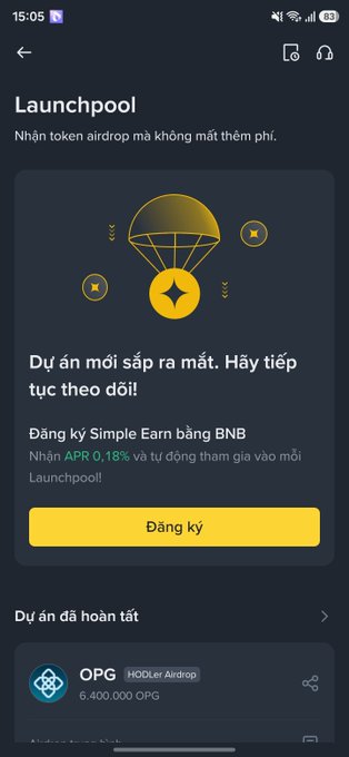 A mobile screenshot of the Binance 'Launchpool' page in Vietnamese, promoting token airdrops with a 'Đăng ký' (Register) button and showing a completed project called 'OPG HODLer Airdrop' distributing 6,400,000 OPG tokens.