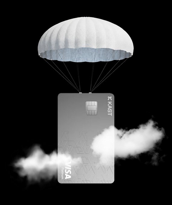 A grey Kaspi Visa Titanium credit card descending with a white parachute through clouds against a black background.