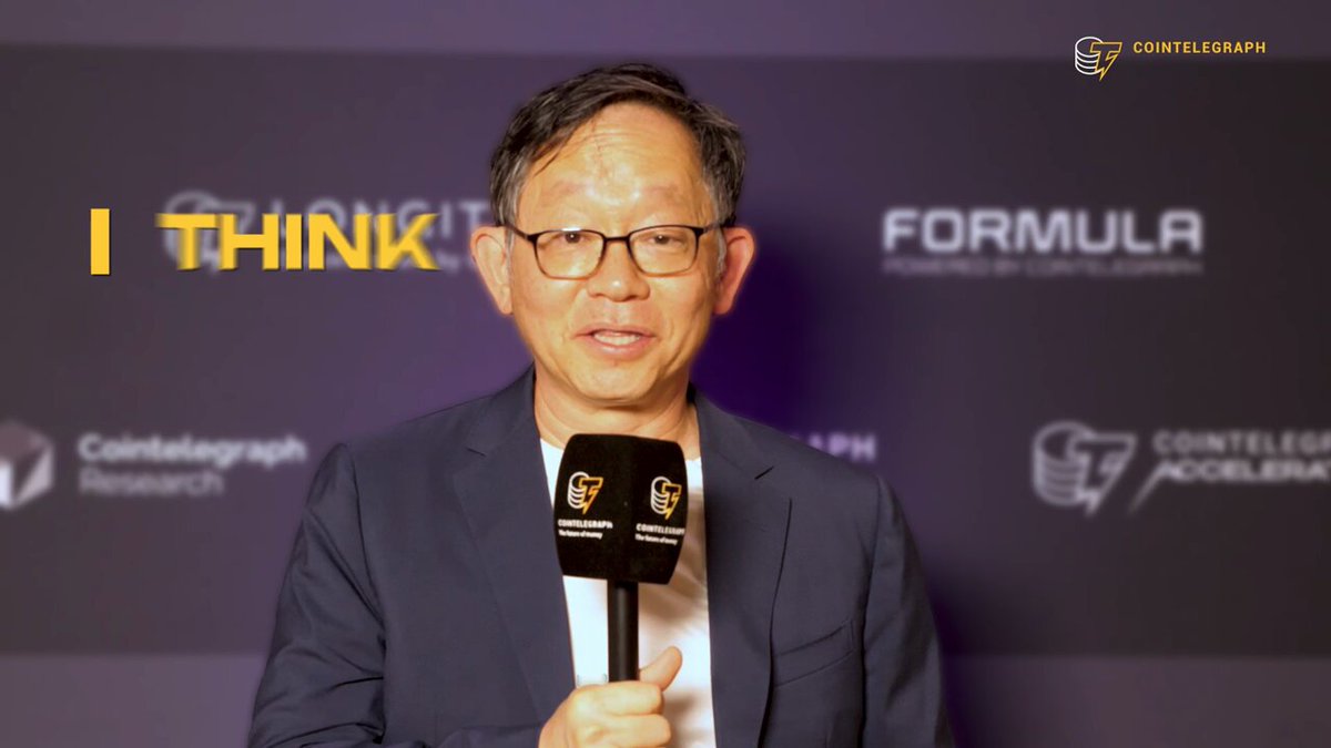 The image features an older man wearing glasses and holding a microphone, standing against a purple background with logos for companies such as "Sui", "coinformation research", and "coinformation". The man appears to be speaking into a microphone or conducting an interview. The text in the image reads "I THINK" followed by "formula", which suggests that he is discussing a topic related to the Formula One company, possibly their business model or strategy.
