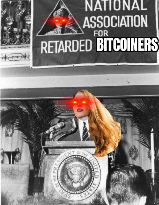 The image features a woman with red eyes standing behind a podium, wearing a suit and tie. She appears to be giving a speech or presentation at an event. The text "I'M THE NEW CRO OF BITTCOINERS" is written above her head, suggesting that she is the new leader of Bitcoin miners.