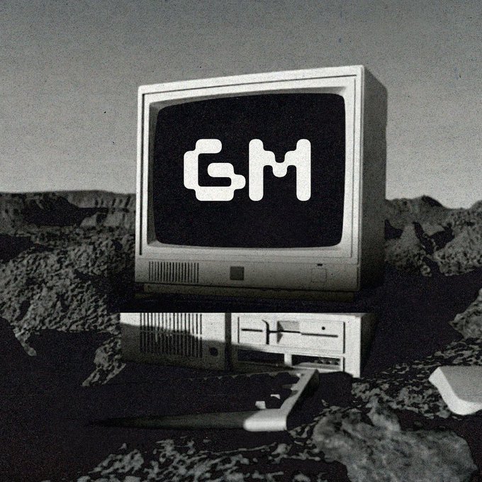 A retro CRT computer monitor and keyboard sit on a rocky, lunar-like terrain, with the screen displaying the bold "GM" logo. The image's directness mirrors the post's blunt, no-nonsense tone about GM.