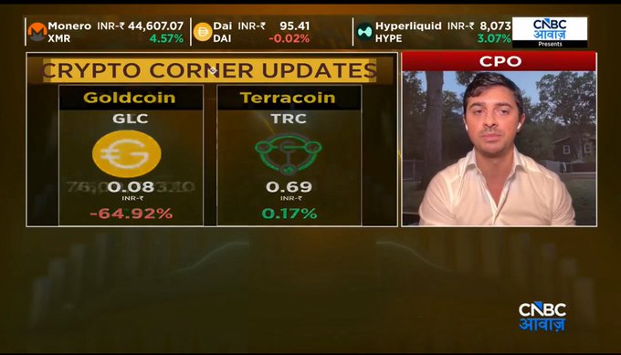 A screenshot from CNBC আবাজ showing 'CRYPTO CORNER UPDATES' with prices for 'Goldcoin' (GLC) and 'Terracoin' (TRC), alongside a news anchor and a top ticker for Monero (XMR), Dai (DAI), and Hyperliquid (HYPE).
