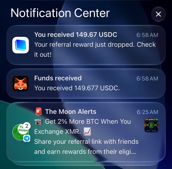 Smartphone notification center showing received 149.67 USDC referral rewards, funds received, and a "The Moon Alerts" notification about earning 2% more BTC when exchanging XMR.