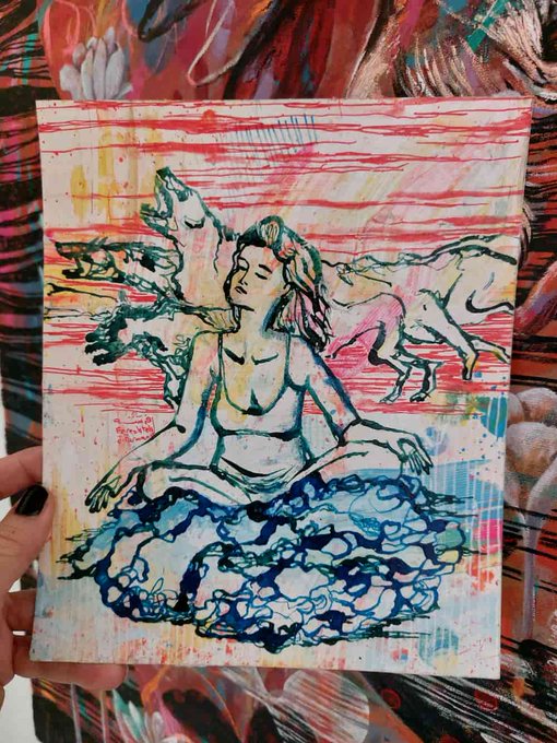 화리스크로운데이터에서, a person holding an art piece with a woman sitting on top of a rock. The painting is done in a watercolor style and features a girl and dogs as the main subjects. The post seems to be about a specific artist or artwork, but it's not clear what that might be from the image alone.
