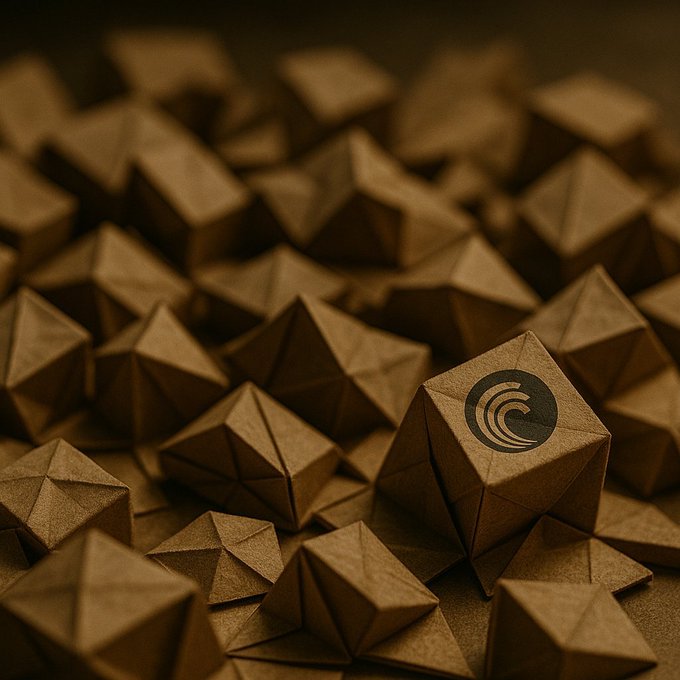 A pile of brown, paper-textured geometric polyhedron shapes, with one prominently displaying a black wave logo in the center.