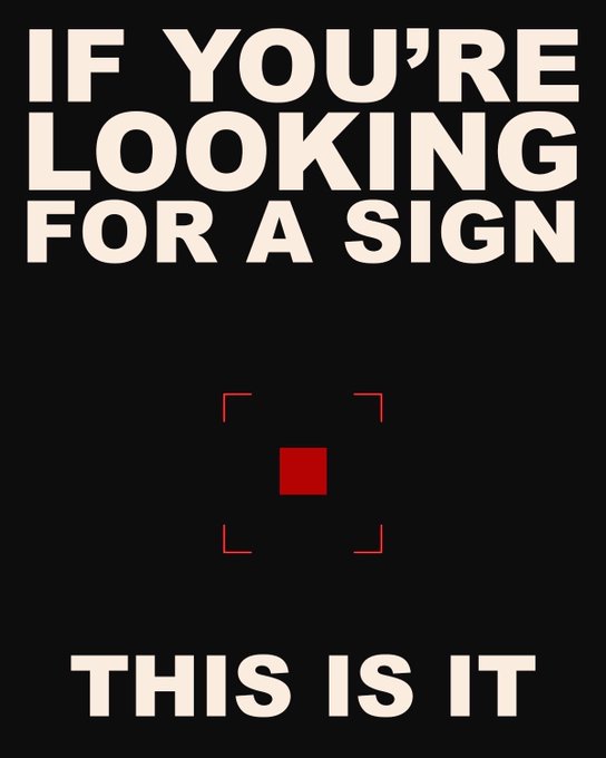 A black poster with cream text reading 'IF YOU'RE LOOKING FOR A SIGN' above a red square marker and 'THIS IS IT' below it.