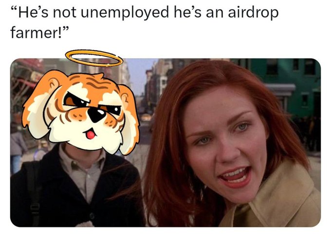 The image features an orange tiger with a large head, standing next to a woman wearing a tan jacket. The text above the image reads "He's not employed he's an airdrop farmer", which seems to be a humorous statement about the woman being an airdrop farmer.