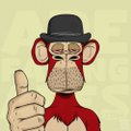 A cartoon monkey wearing a black bowler hat and red shirt gives a thumbs-up, with the "vouch2earn" branding subtly referenced through the monkey's gesture of endorsement. The image likely serves as a mascot promoting the vouch2earn concept.