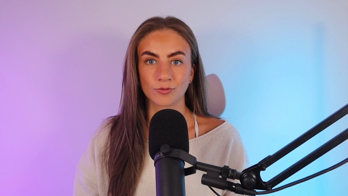 The image features a woman wearing a white shirt, standing next to a microphone that appears to be part of a soundboard or recording equipment. The background consists of a purple wall with a light blue hue. The photo has been captioned "The programmable economy is creating entirely new businesses and founders are leading the way that's why we launched Founder House - help early-stage teams like @bondoncredit accelerate their product and go-to-market on the Arbitrum Platform."