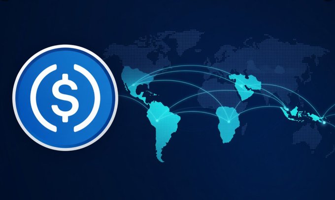 A blue USDC emblem sits beside a world map highlighting developing regions in Latin America, Africa, and Southeast Asia, visually reinforcing Circle's global expansion strategy for the stablecoin, which processes the majority of transaction volume despite trailing Tether ($USDT) in market cap.