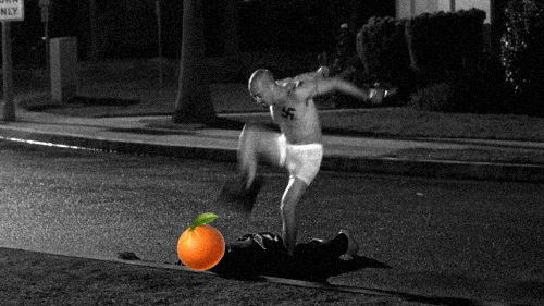 A black and white image showing a man in underwear kicking an orange, creating a comedic photo manipulation effect.