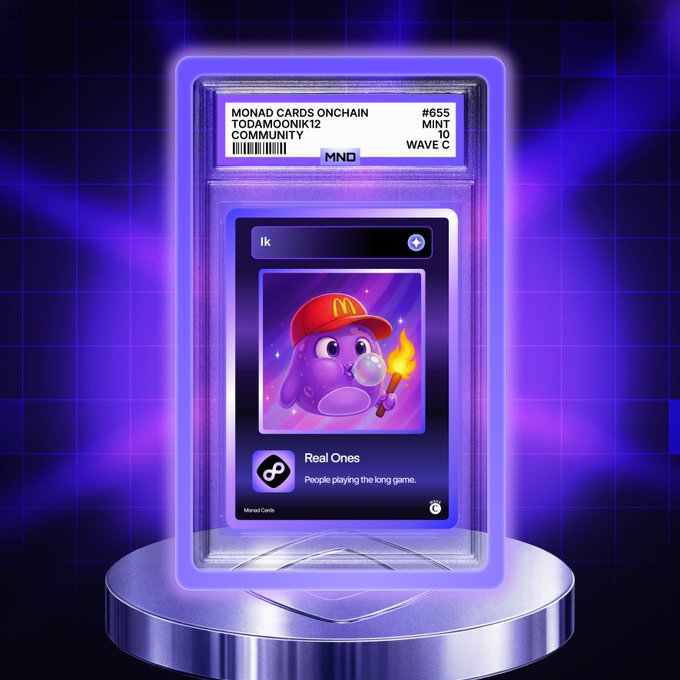 A graded Monad Cards Onchain collectible (Mint 10, Wave C, #655) featuring the "Real Ones" community card is displayed on a neon-lit pedestal, showcasing a purple character blowing a bubble and holding a torch, likely highlighting the artwork by @Penguitt mentioned in the post.