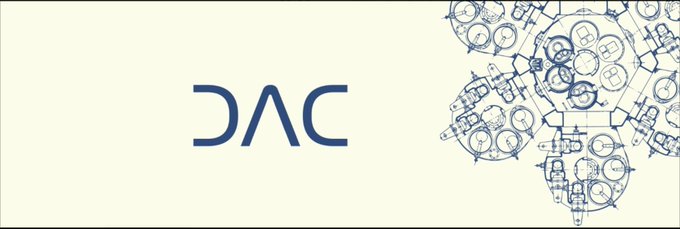 A logo displaying 'DAC' in dark blue stylized lettering on a cream background, accompanied by an intricate circular mechanical blueprint design on the right.