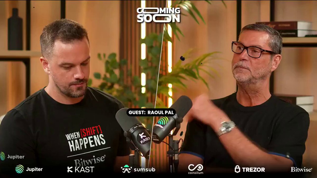 The image features two men standing next to each other, with one man wearing a black shirt and the other wearing glasses. They are both holding microphones, suggesting that they might be hosting or participating in an interview or podcast discussion. The background of the image includes a bookshelf filled with various items such as bottles and vases, indicating that it is likely taking place in someone's home or office setting.

The post contains text related to podcasts and investing, which could be related to the conversation between the two men. It also mentions Bitcoin and shares some advice on selling it. The image focuses on the interaction between the hosts of the podcast, providing a glimpse into their discussion topics and possibly offering insights into the world of investing or cryptocurrency.