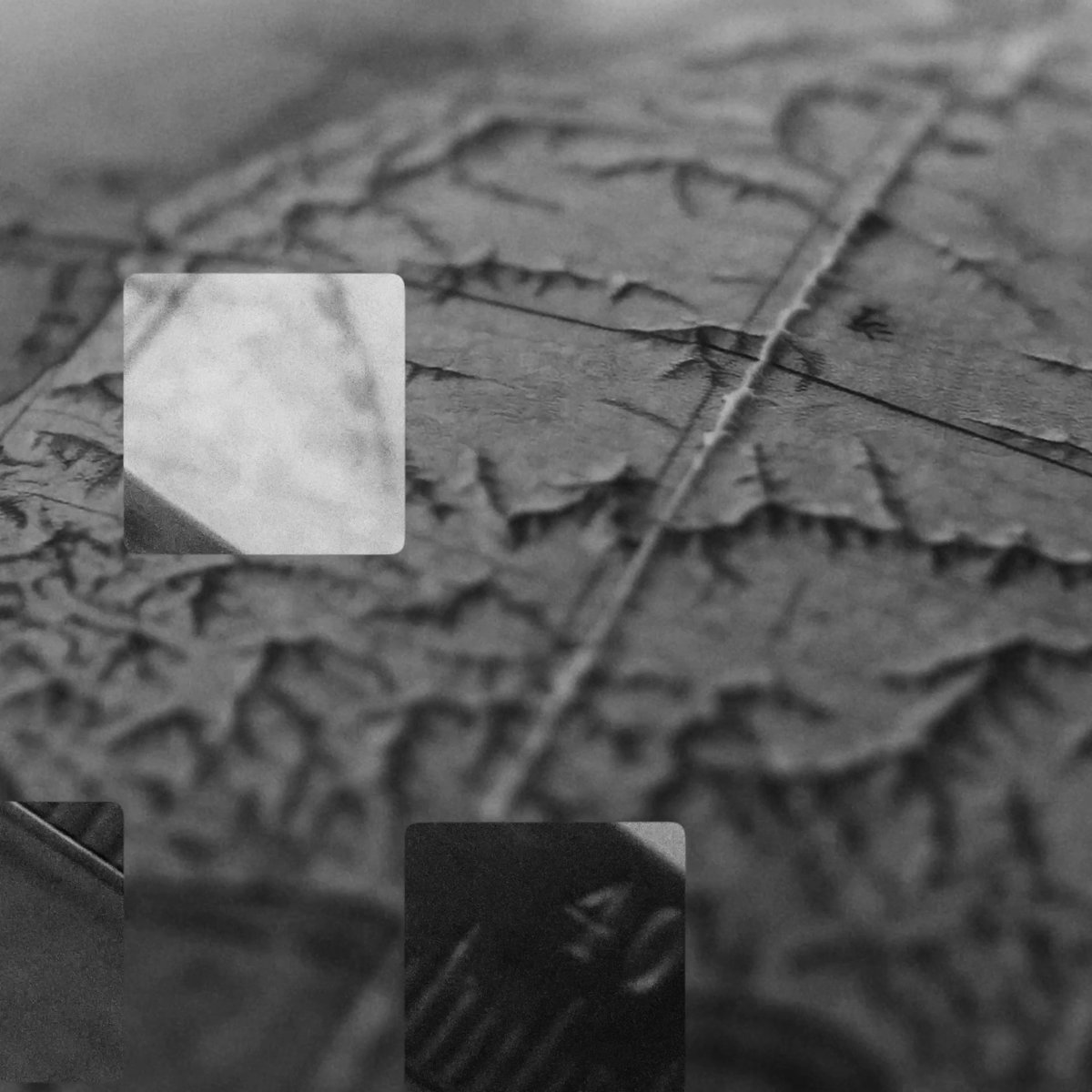 A grayscale image showing the raised lettering "OKX NOW" repeated across a textured tile surface, with a bright reflective square patch overlaid on top, visually reinforcing the event branding for OKX Now Singapore on 6 October.