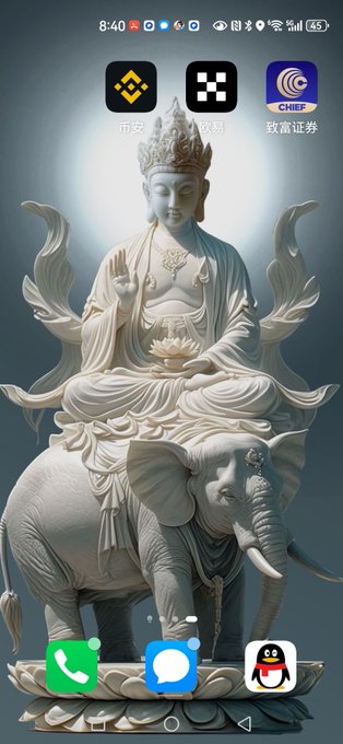 A smartphone home screen displaying a wallpaper of a white stone statue of a deity (likely Guanyin) seated on an elephant, with app icons including Binance, OKX, and a securities app labeled '致業證券 CHIEF' at the top, and Phone, Messages, and QQ at the bottom.