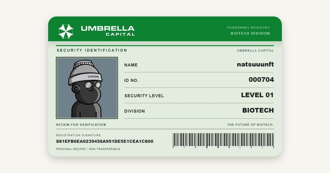 An Umbrella Capital security identification card for 'natsuuunft' (ID 000704) with a Security Level 01 in the Biotech division, featuring a cartoon character wearing a CHRONO beanie.