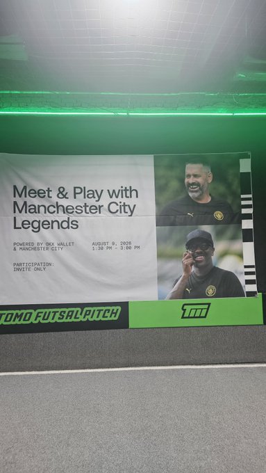 A promotional banner at Tomo Futsal Pitch reading "Meet & Play with Manchester City Legends" powered by OKX Wallet & Manchester City, dated August 9, 2026, featuring photos of Pep Guardiola and another coach.