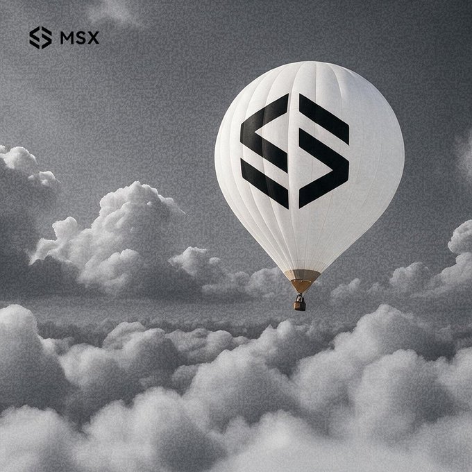 A grayscale image of a white hot air balloon displaying the 'MSX' logo floating above clouds, with the MSX brand logo also visible in the upper left corner.