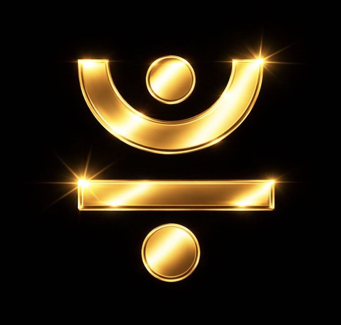 A golden geometric symbol featuring a U-shape with a circle on top, a horizontal bar in the middle, and another circle on the bottom, set against a black background with bright starburst highlights.