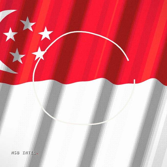 A stylized illustration of the Singapore flag with its red and white halves and crescent moon and stars design, overlaid with a white circular outline and labeled "MSB INTEL" in the corner, visually representing the country's regulatory move to oversee stablecoins with full reserve backing and freeze authority.