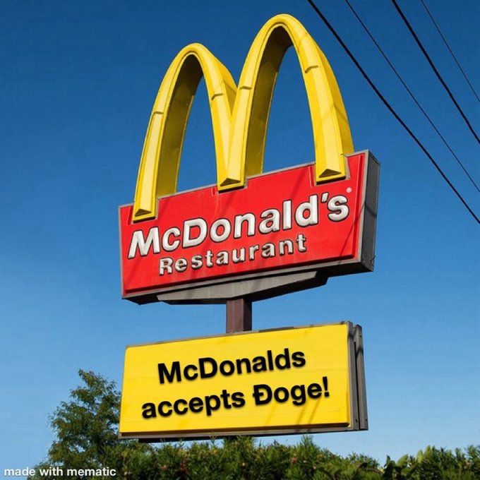 The image features an advertisement for a McDonald's restaurant with a large sign that showcases their menu items, including a hamburger, hot dog, and chicken sandwich. Additionally, there are several humorous phrases written underneath the McDonald's sign, such as "McDONALD'S Restaurant accepts Doge!". This suggests a playful and lighthearted approach to advertising, possibly targeting younger customers who enjoy fun and quirky content on social media platforms like Twitter.