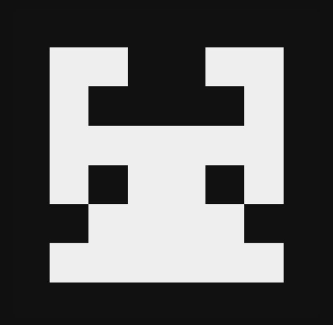 A minimalist black and white pixel art design resembling a stylized face or blocky figure.