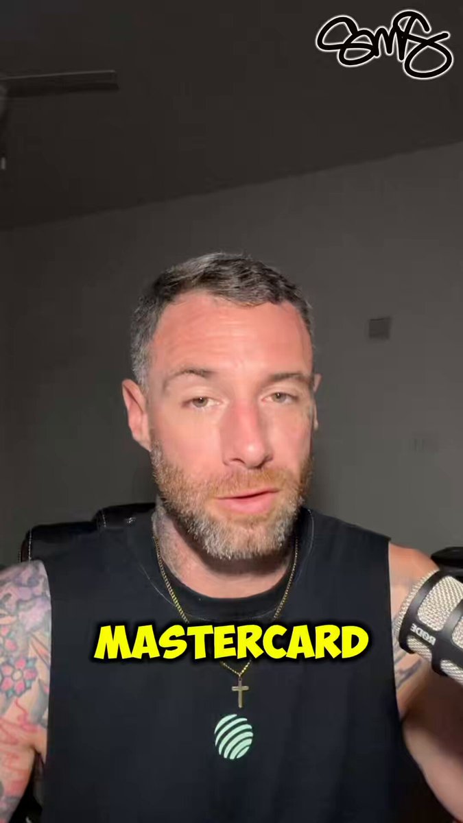 The image features a man with a beard wearing a black shirt, who appears to be posing for a picture or participating in an online poll. The text "Mastercard" can also be seen in the image.