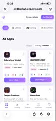 A mobile screenshot of the emblemhub.emblem.build website displaying the 'All Apps' page with apps like Bobo's Bear Market, Dog moon runner, Dragon Guardians, and MemeRider visible in the browser.