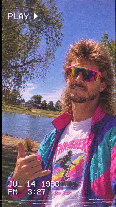 A vintage camcorder-style photo dated JUL 14 1986 PM 3:27 shows a man with a mullet, neon sunglasses, and a colorful 80s windbreaker over a Thrasher t-shirt, giving a shaka hand sign near a lake.