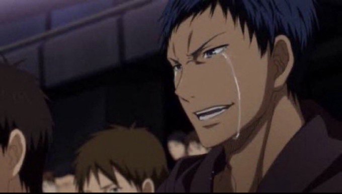 An anime character with short dark hair and a sharp grin sheds a tear while standing among a crowd.