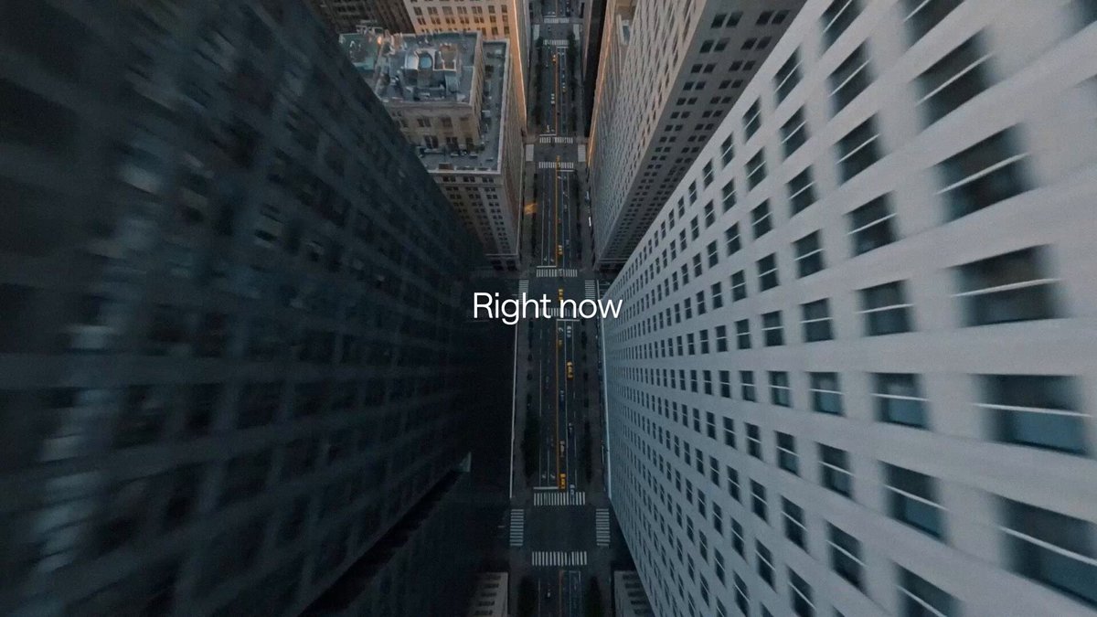 The image shows a cityscape with tall buildings at different heights, including one that appears blurry due to motion blur. The caption reads "Right now", which could be interpreted as an advertisement or promotional message for Umbra, a privacy application.
