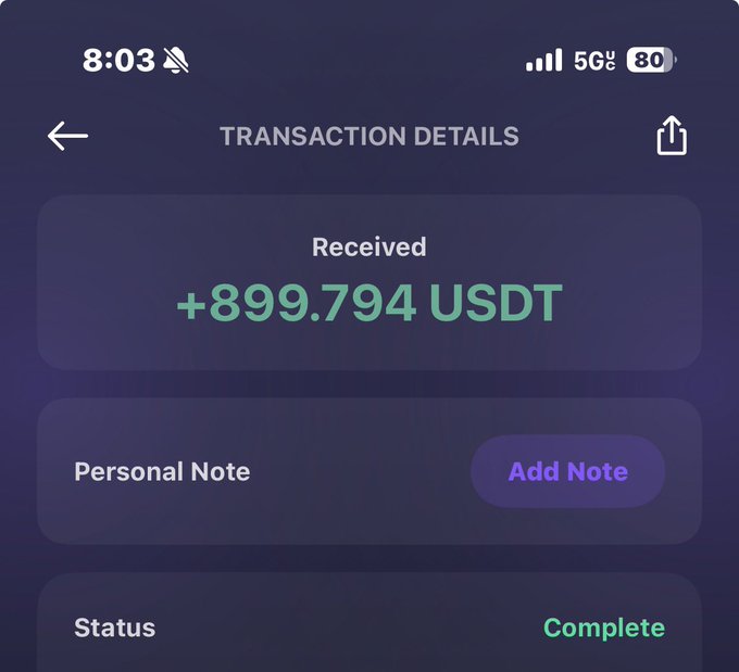 A cellphone displaying a transaction details with a number of transactions. The phone screen shows a personal note with a payment of $900.00 received, plus an additional user note for completing this transaction. The phone's status indicates that this was completed successfully.