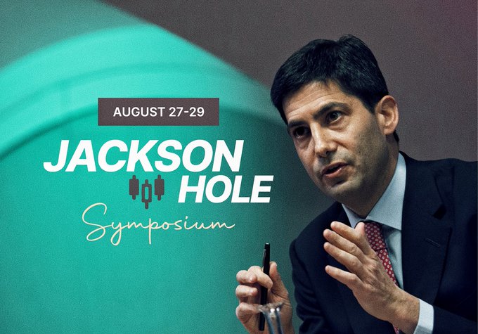 The image is a promotional graphic for the Jackson Hole Symposium dated "August 27-29," featuring a photo of a man in a suit gesturing while speaking, likely Federal Reserve Chair Kevin Warsh mentioned in the post. The design highlights the event as a major market catalyst where Fed officials are expected to provide signals on monetary policy, with particular relevance to crypto markets like Bitcoin ($BTC) and altcoins ($ALTs) facing potential volatility.