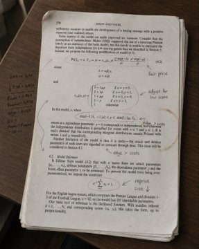 A photograph of a textbook page about 'GROUP FUNCTIONS' covered in handwritten mathematical annotations and sticky notes.